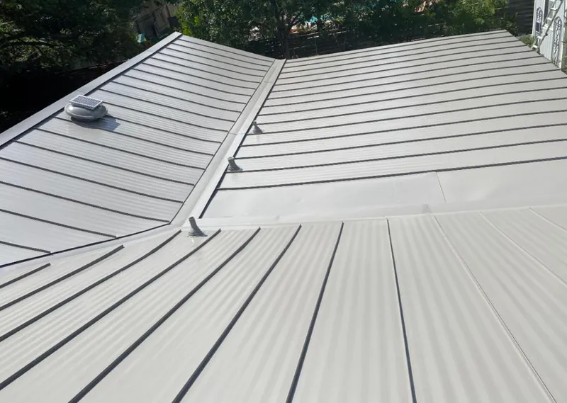 Solar attic fan installed on a metal roof for Roof Ventilation in Spanish Fort